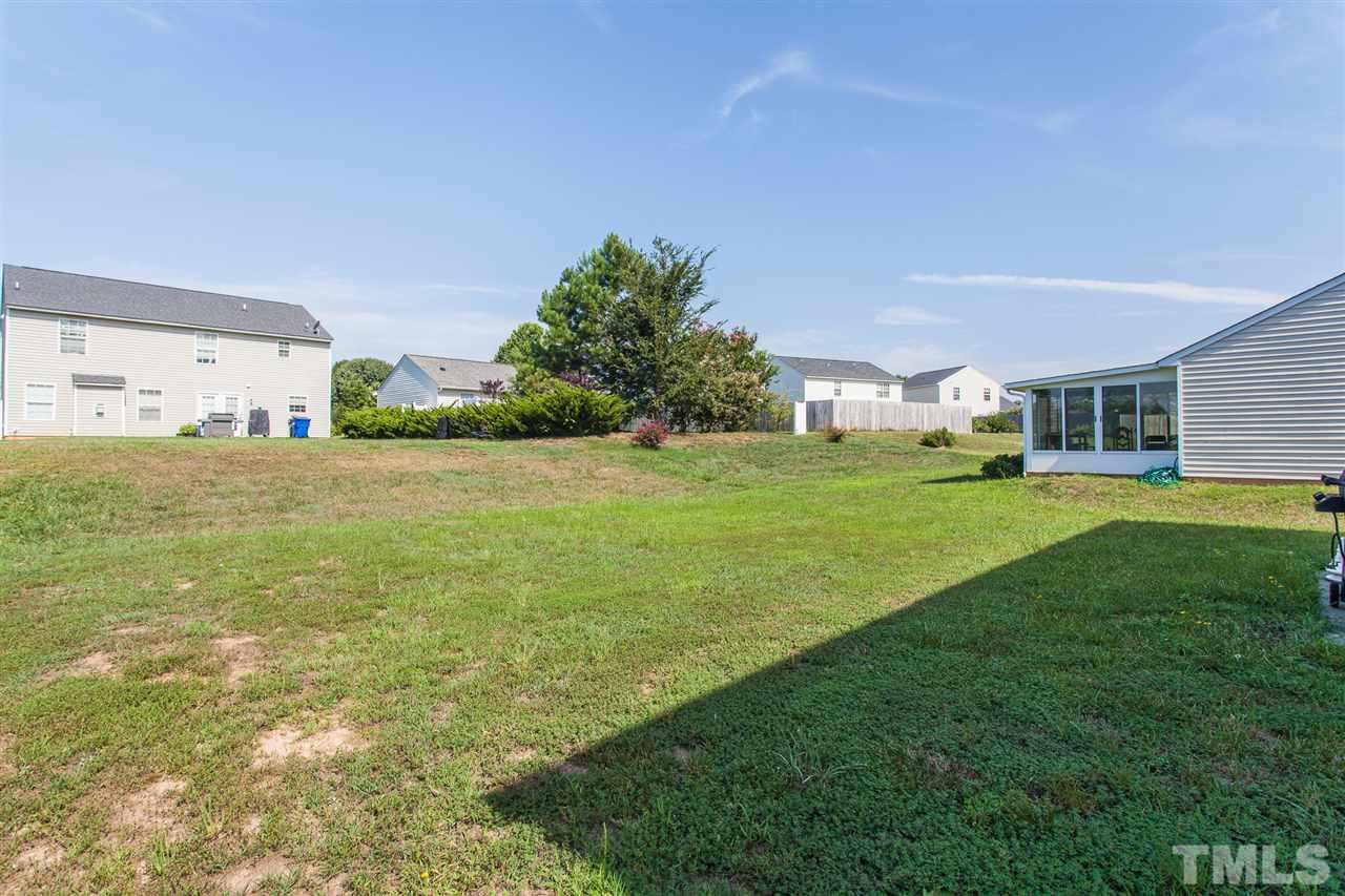 3628 Watkins Ridge Court Raleigh, NC 27616 - Photo 6 of 6 a view of a big yard with a large trees