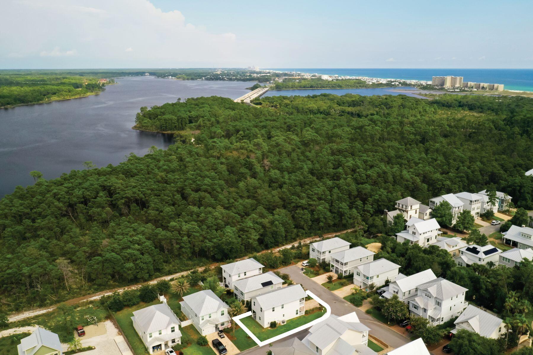 15 Cam Cove Inlet Beach Inlet Beach, FL 32461 - Photo 35 of 35 an aerial view of a house with a yard and lake view