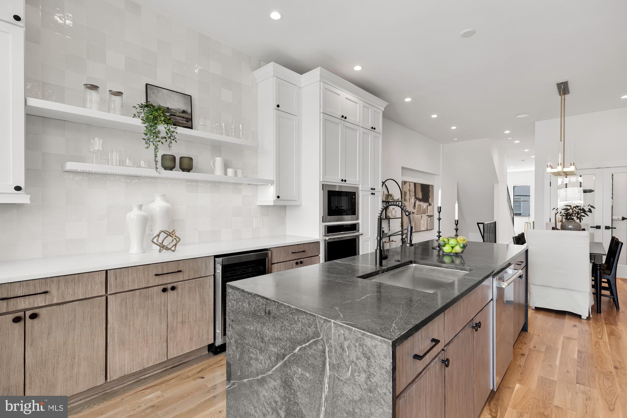 623 South Rose Street Baltimore, MD 21224 - Photo 1 of 12 a kitchen with granite countertop a sink a stove and cabinets