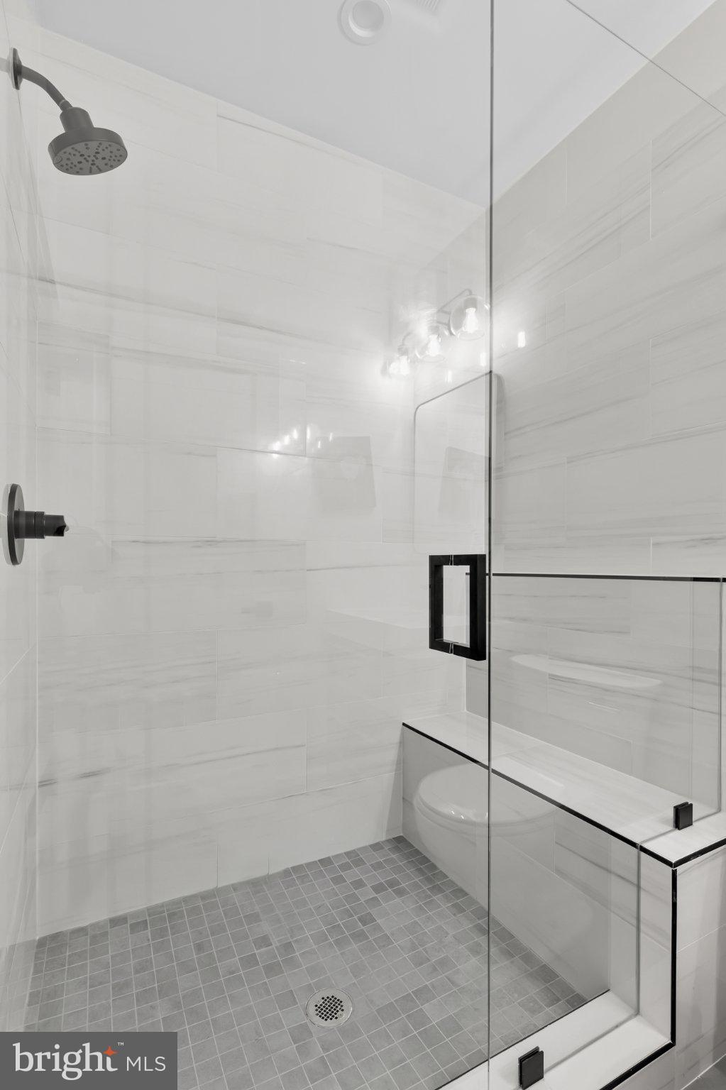 623 South Rose Street Baltimore, MD 21224 - Photo 12 of 12 a bathroom with a shower and a glass door