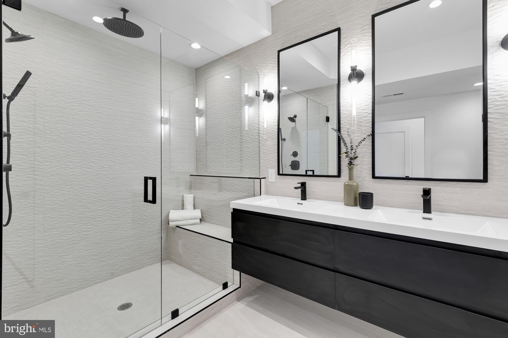 623 South Rose Street Baltimore, MD 21224 - Photo 6 of 12 a bathroom with a double vanity sink mirror and shower