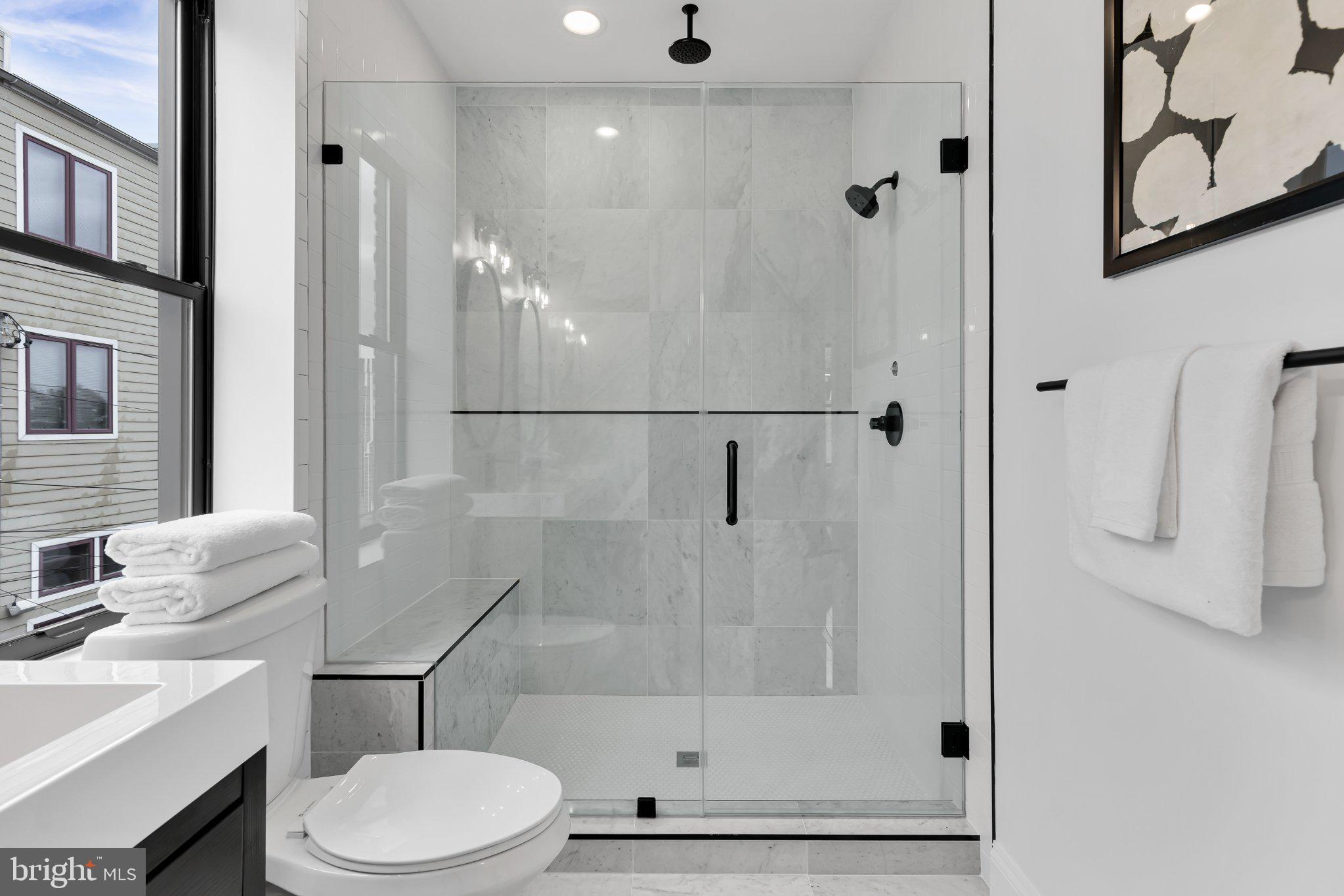 623 South Rose Street Baltimore, MD 21224 - Photo 8 of 12 a bathroom with a toilet sink and shower