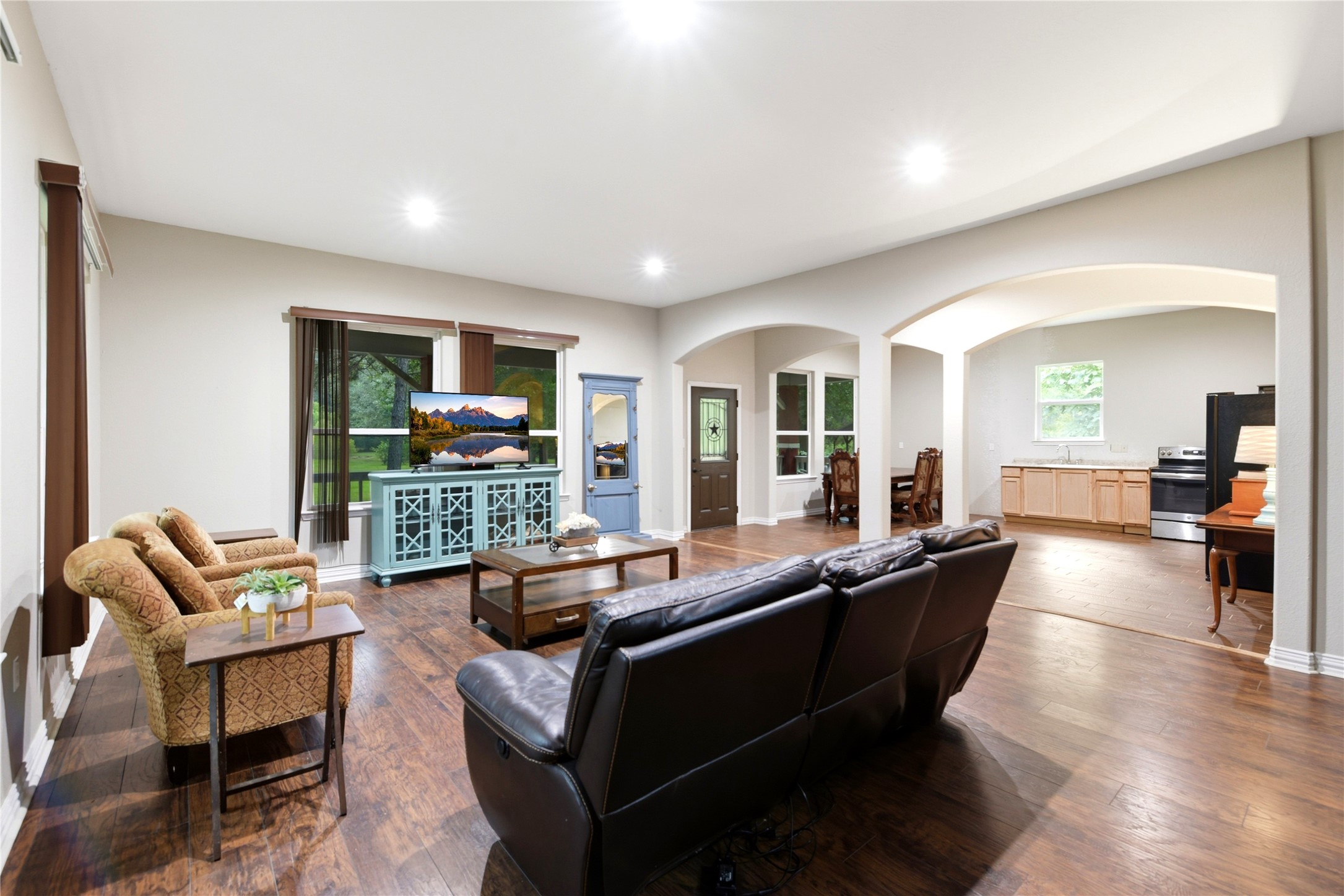 1151 County Line Road Shepherd, TX 77371 - Photo 13 of 48 Family room, front door, Dining and kitchen. Lots of light from windows from windows on three sides.