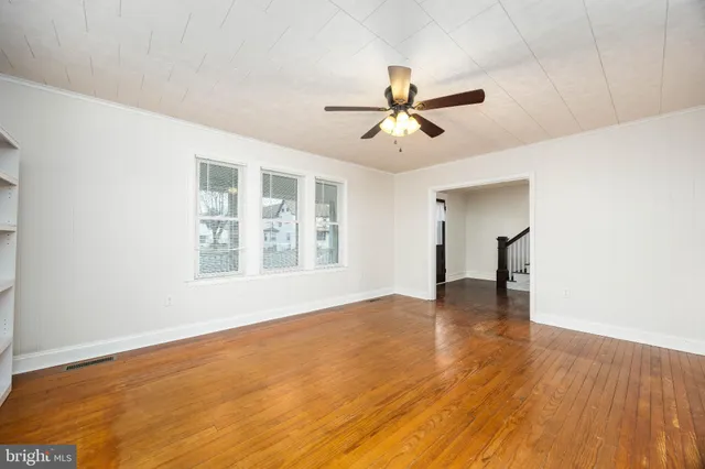 a spacious bathroom with a granite countertop toilet sink and mirror