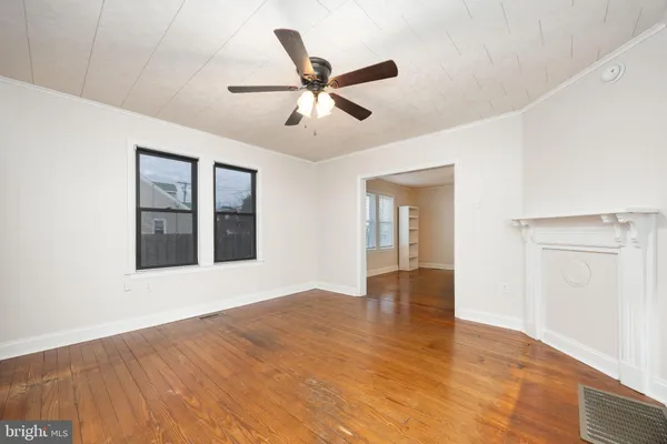 a bathroom with a granite countertop sink toilet a large mirror a vanity and shower