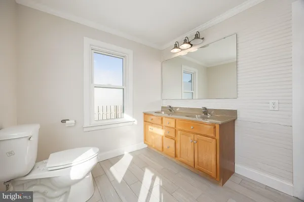 a view of a bathroom from a hallway
