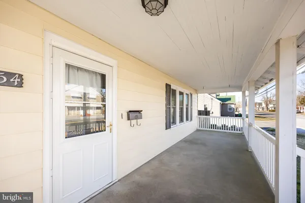 a view of a balcony with wooden floor