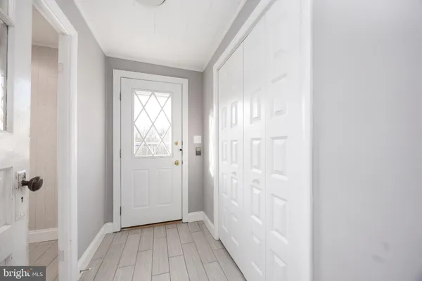 a bathroom with a granite countertop sink a mirror and a bathtub