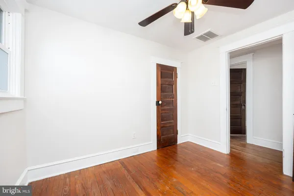 a view of a room with wooden walls