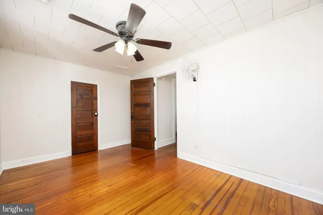 a view of a house with wooden floor and fence
