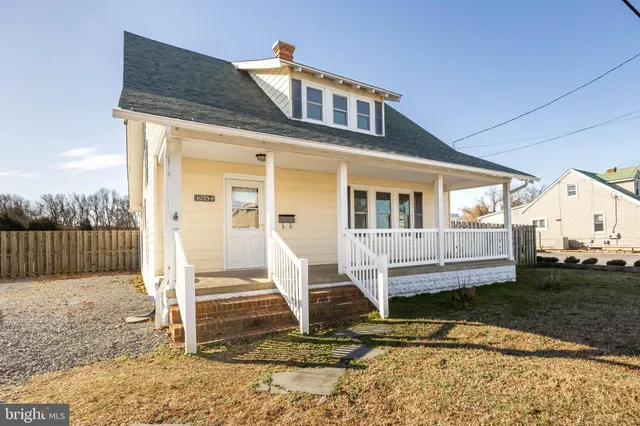 a kitchen with a sink cabinets stainless steel appliances and a window