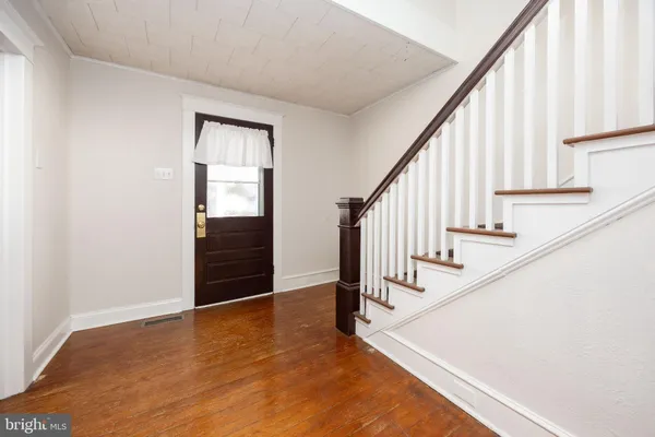 a kitchen with stainless steel appliances a refrigerator sink and microwave