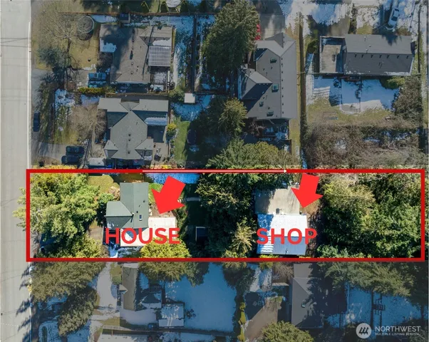 an outdoor sitting area with lots of green trees