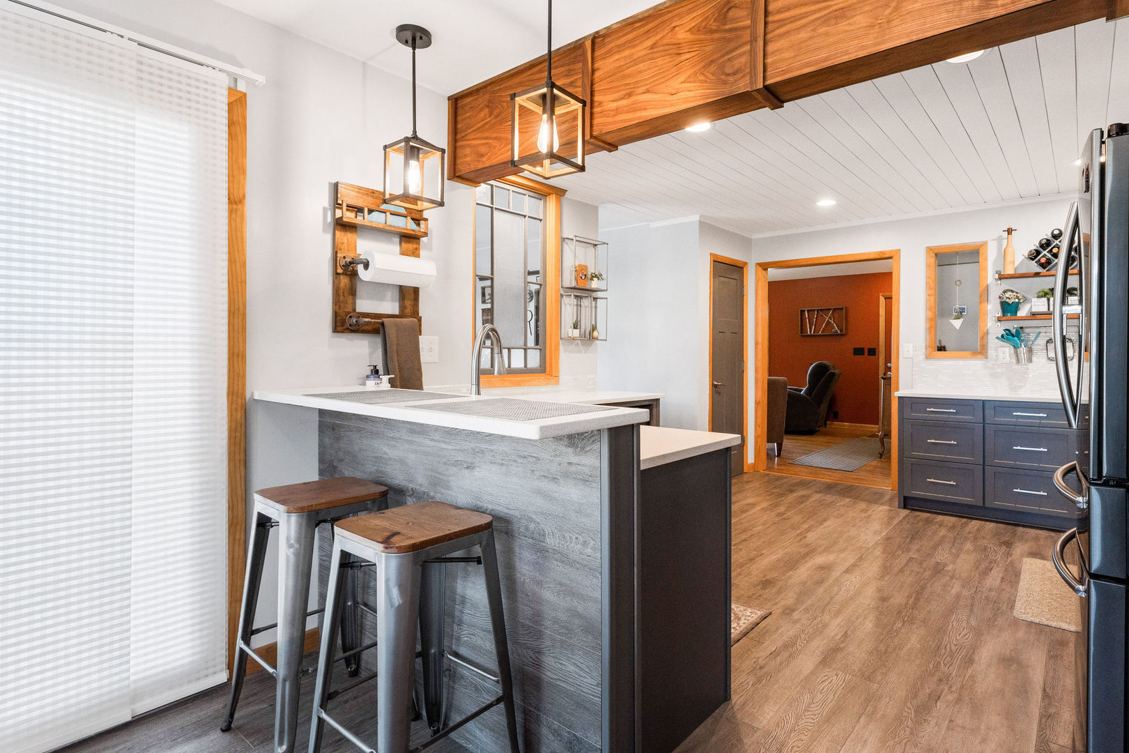 533 Bethany Road Sycamore, IL 60178 - Photo 11 of 38 a living room with furniture a flat screen tv and a table
