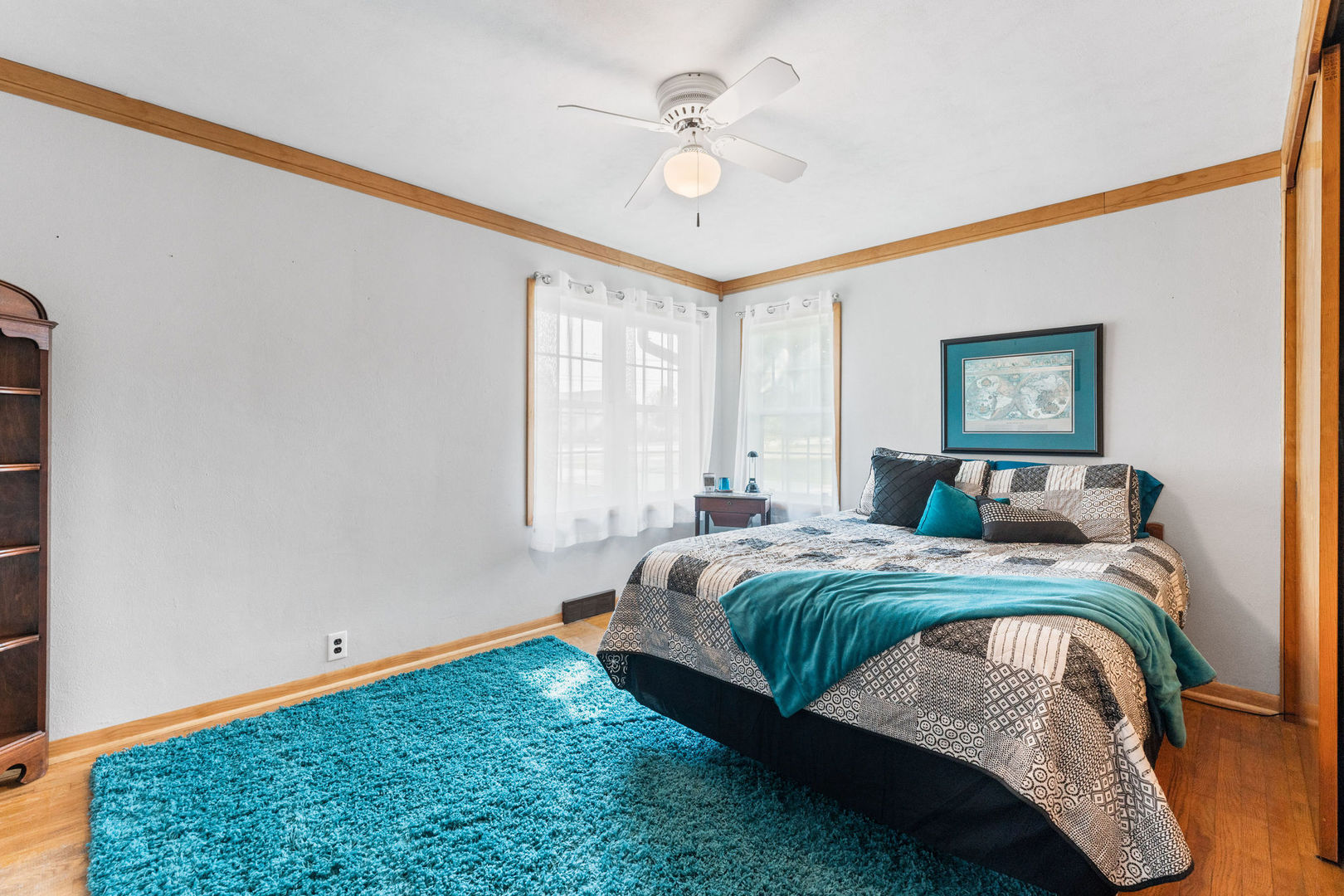 533 Bethany Road Sycamore, IL 60178 - Photo 15 of 38 a bedroom with a bed and a ceiling fan