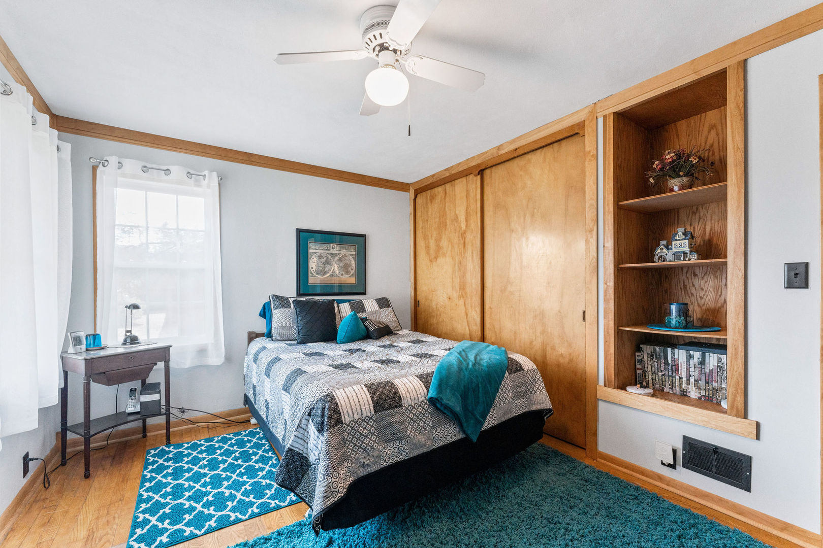 533 Bethany Road Sycamore, IL 60178 - Photo 16 of 38 a bedroom with a bed bookshelf and a window