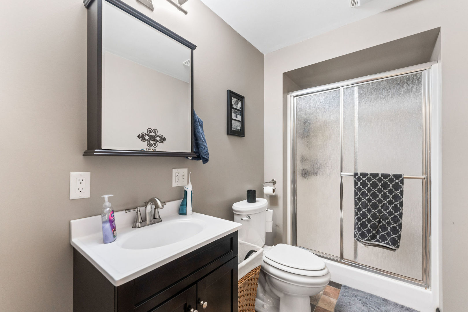 533 Bethany Road Sycamore, IL 60178 - Photo 18 of 38 a bathroom with a sink toilet and shower