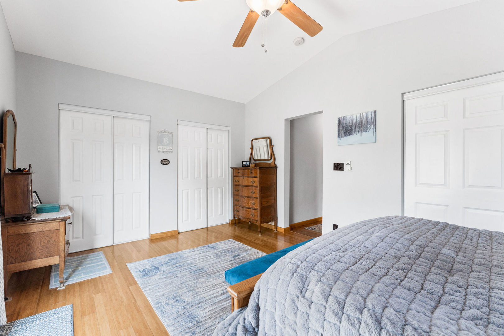 533 Bethany Road Sycamore, IL 60178 - Photo 20 of 38 a bedroom with a bed and wooden floor