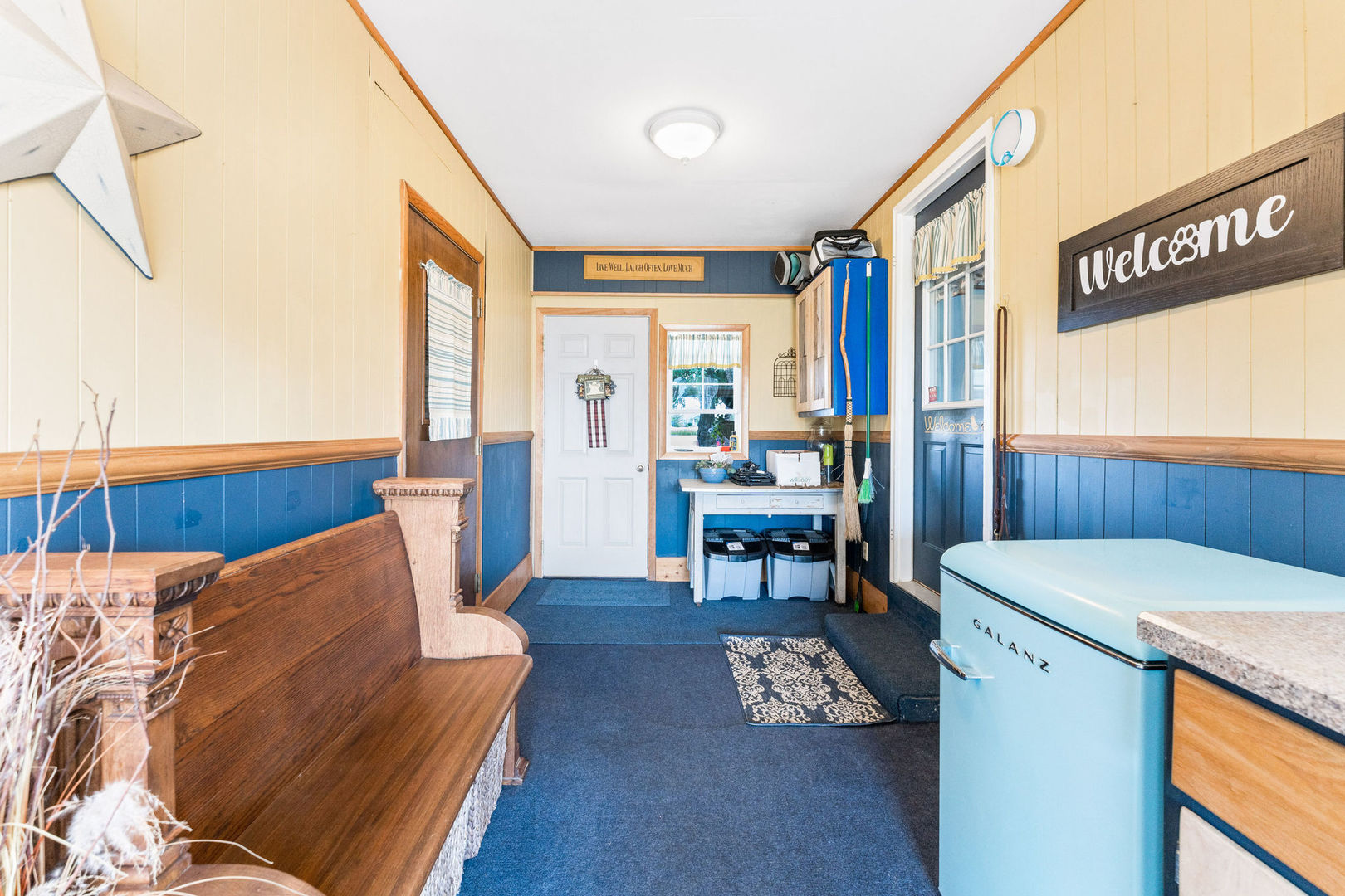 533 Bethany Road Sycamore, IL 60178 - Photo 24 of 38 a living room with furniture and a table