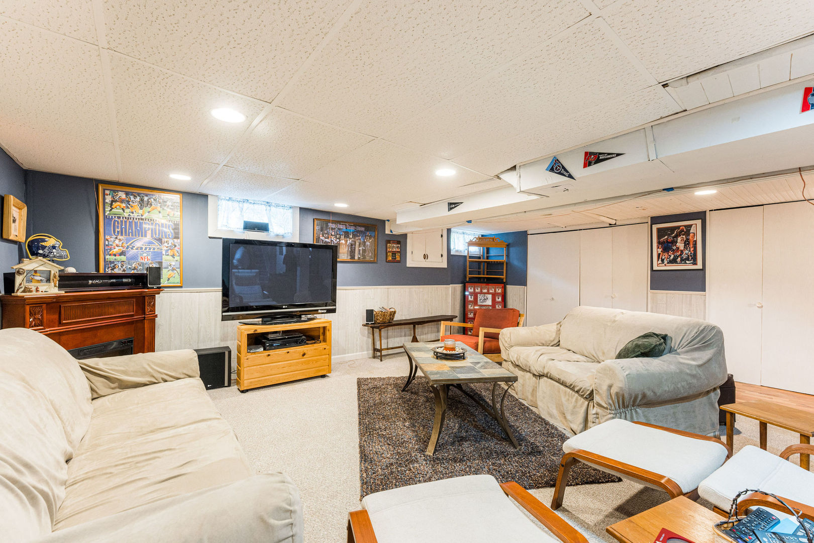 533 Bethany Road Sycamore, IL 60178 - Photo 26 of 38 a living room with furniture and a flat screen tv