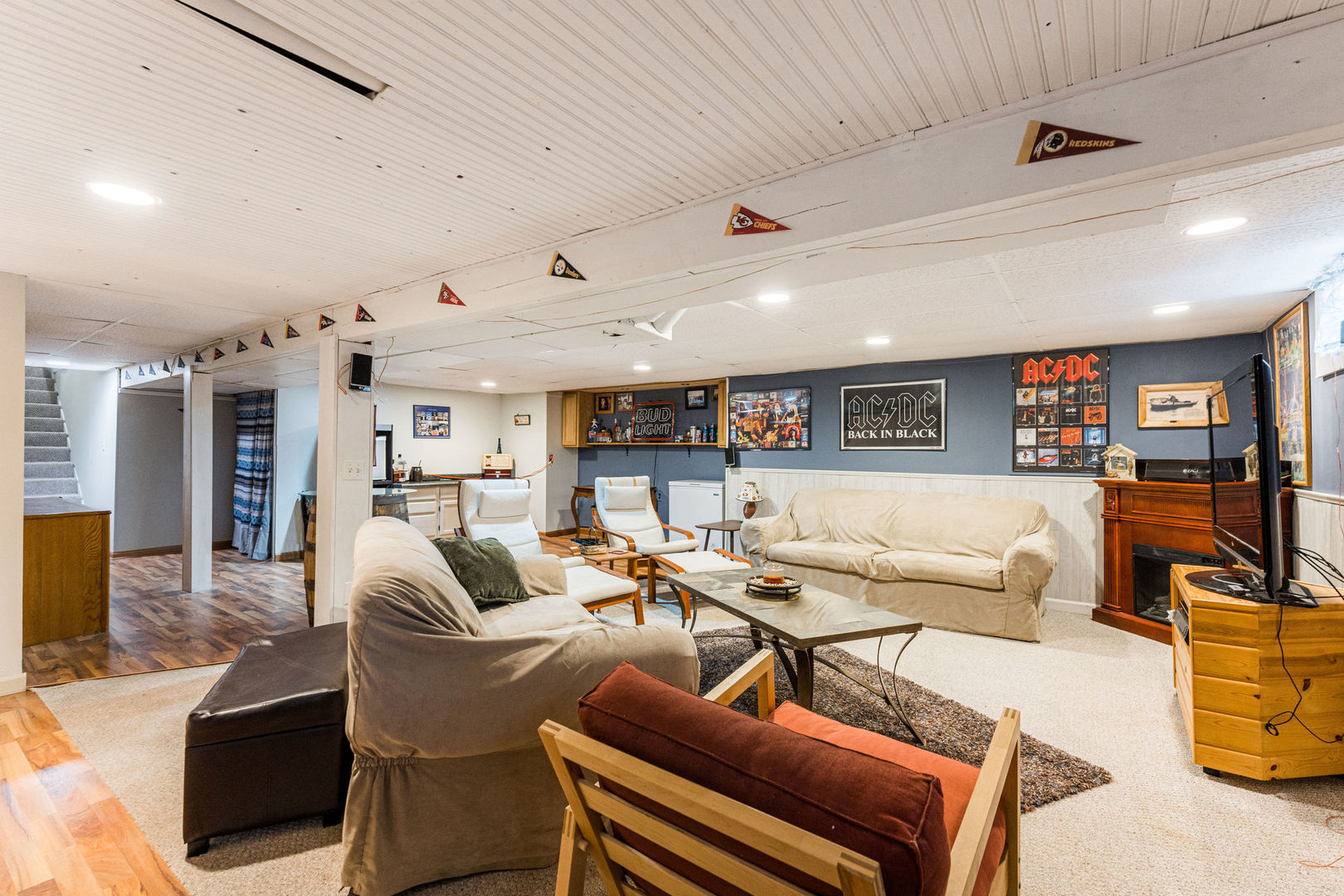 533 Bethany Road Sycamore, IL 60178 - Photo 27 of 38 a living room with furniture and a bookshelf