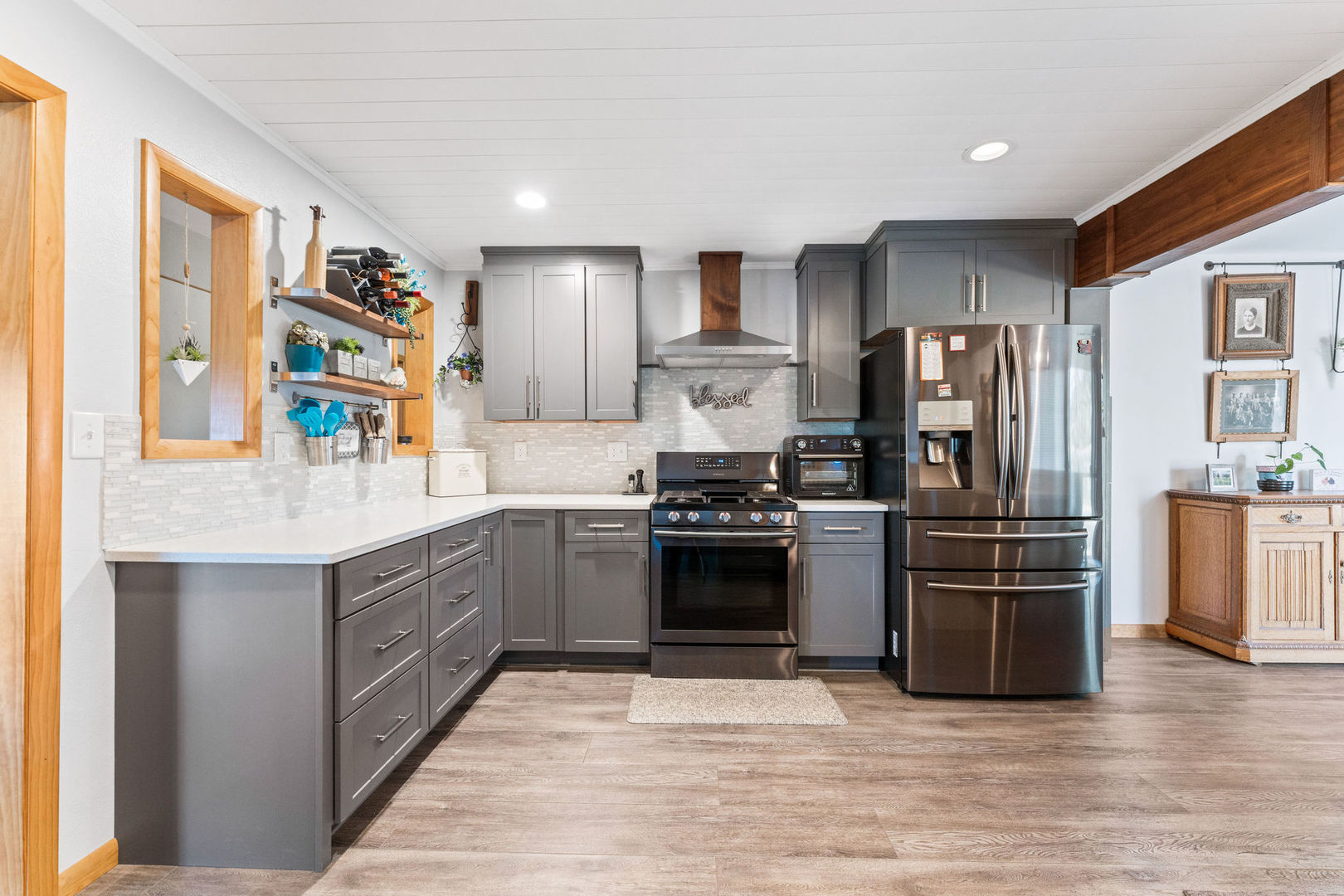 533 Bethany Road Sycamore, IL 60178 - Photo 7 of 38 a kitchen with stainless steel appliances granite countertop a refrigerator stove and oven