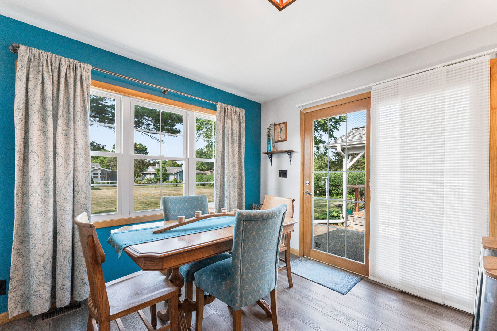 533 Bethany Road Sycamore, IL 60178 - Photo 10 of 38 a dining room with furniture window and wooden floor