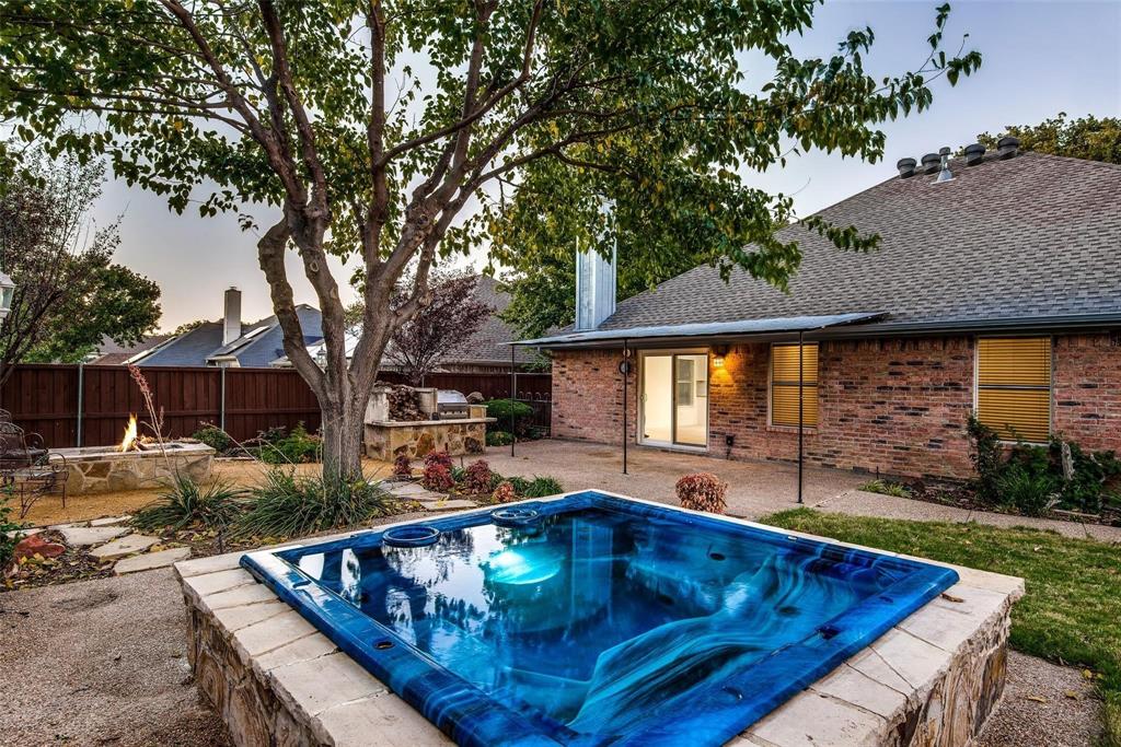2504 Whetstone Drive Corinth, TX 76210 - Photo 18 of 19 a view of backyard with swimming pool and outdoor seating