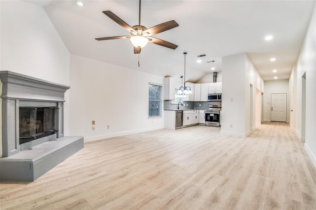 2504 Whetstone Drive Corinth, TX 76210 - Photo 6 of 19 a view of a kitchen with a sink and a stove top oven