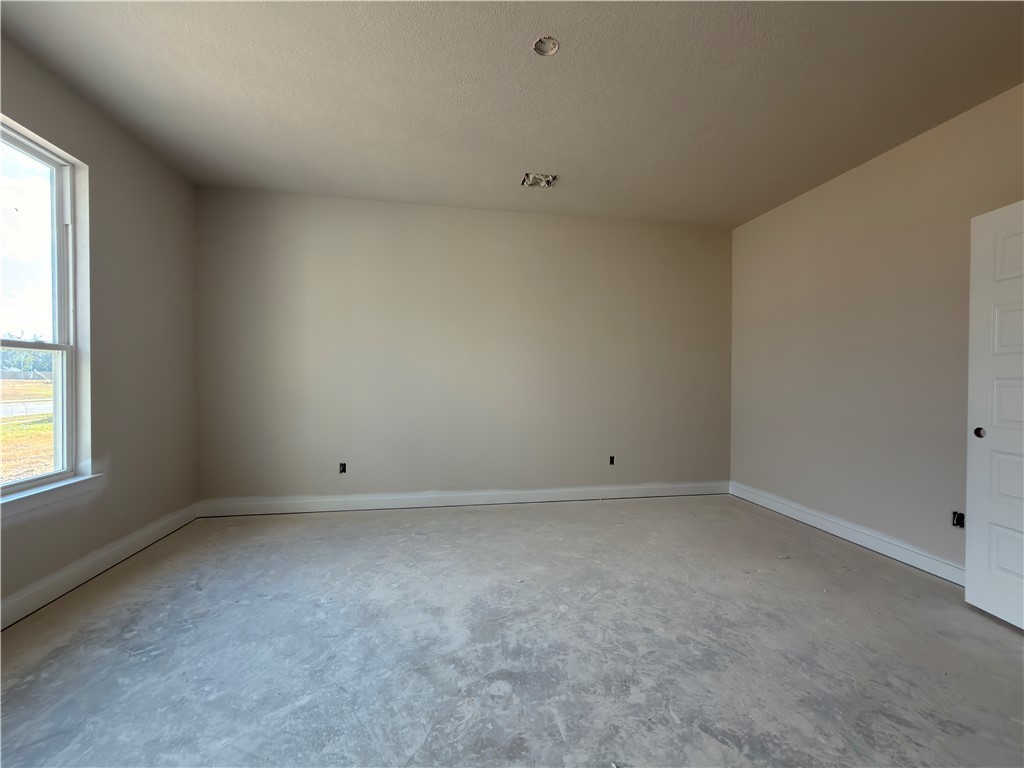 6064 Badger Street Bryan, TX 77807 - Photo 7 of 9 an empty room with a window