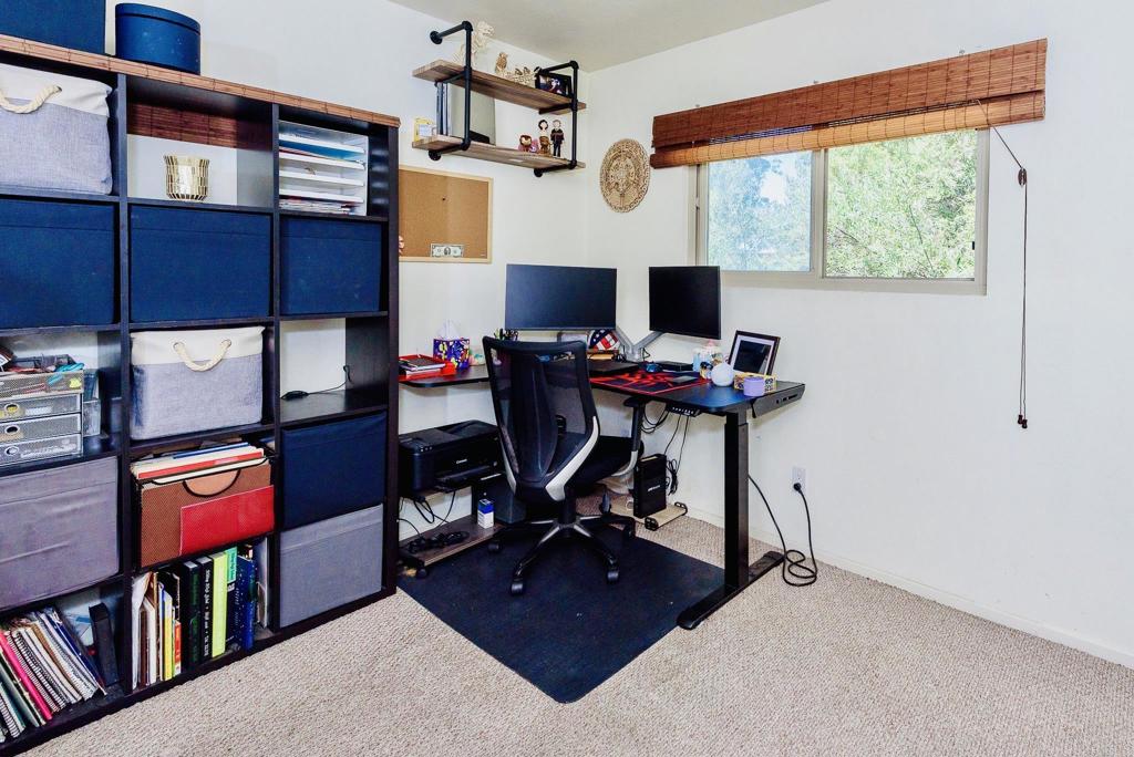 391 Emerald Avenue, Unit 12 El Cajon, CA 92020 - Photo 11 of 15 a view of a workspace with furniture and a window