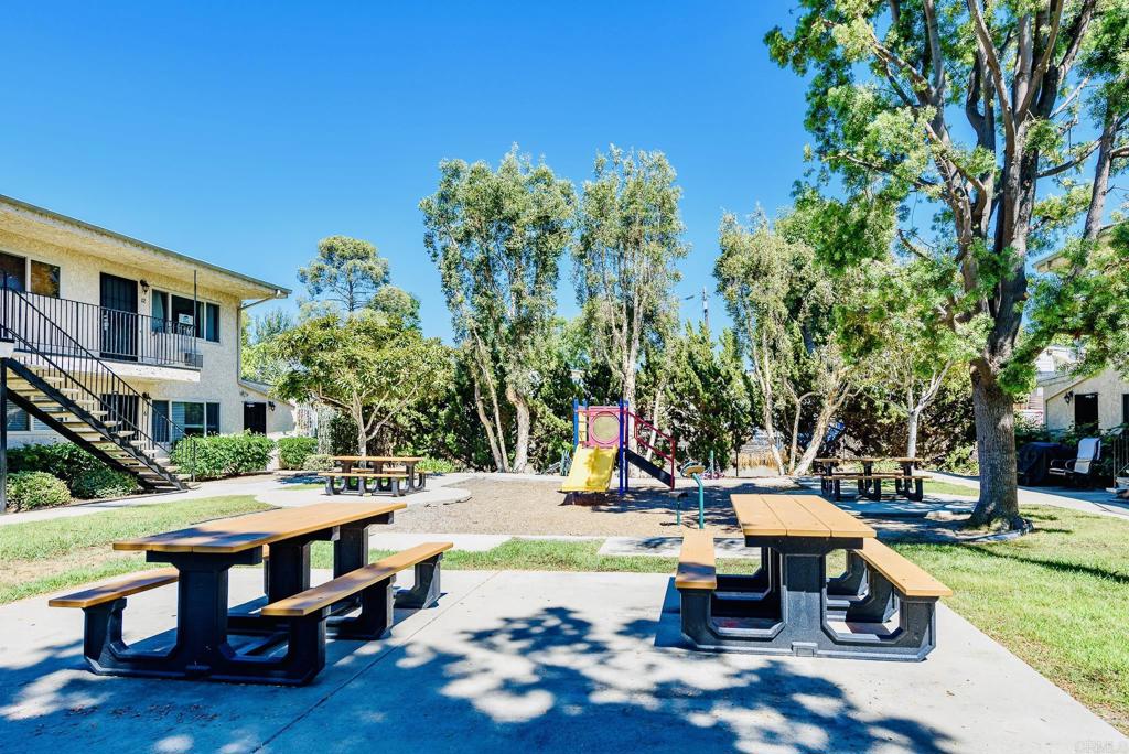 391 Emerald Avenue, Unit 12 El Cajon, CA 92020 - Photo 12 of 15 a view of backyard with swimming pool and green space