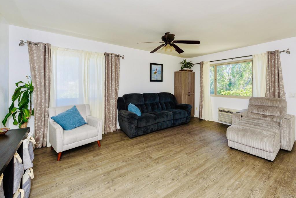 391 Emerald Avenue, Unit 12 El Cajon, CA 92020 - Photo 5 of 15 a living room with furniture and a large window