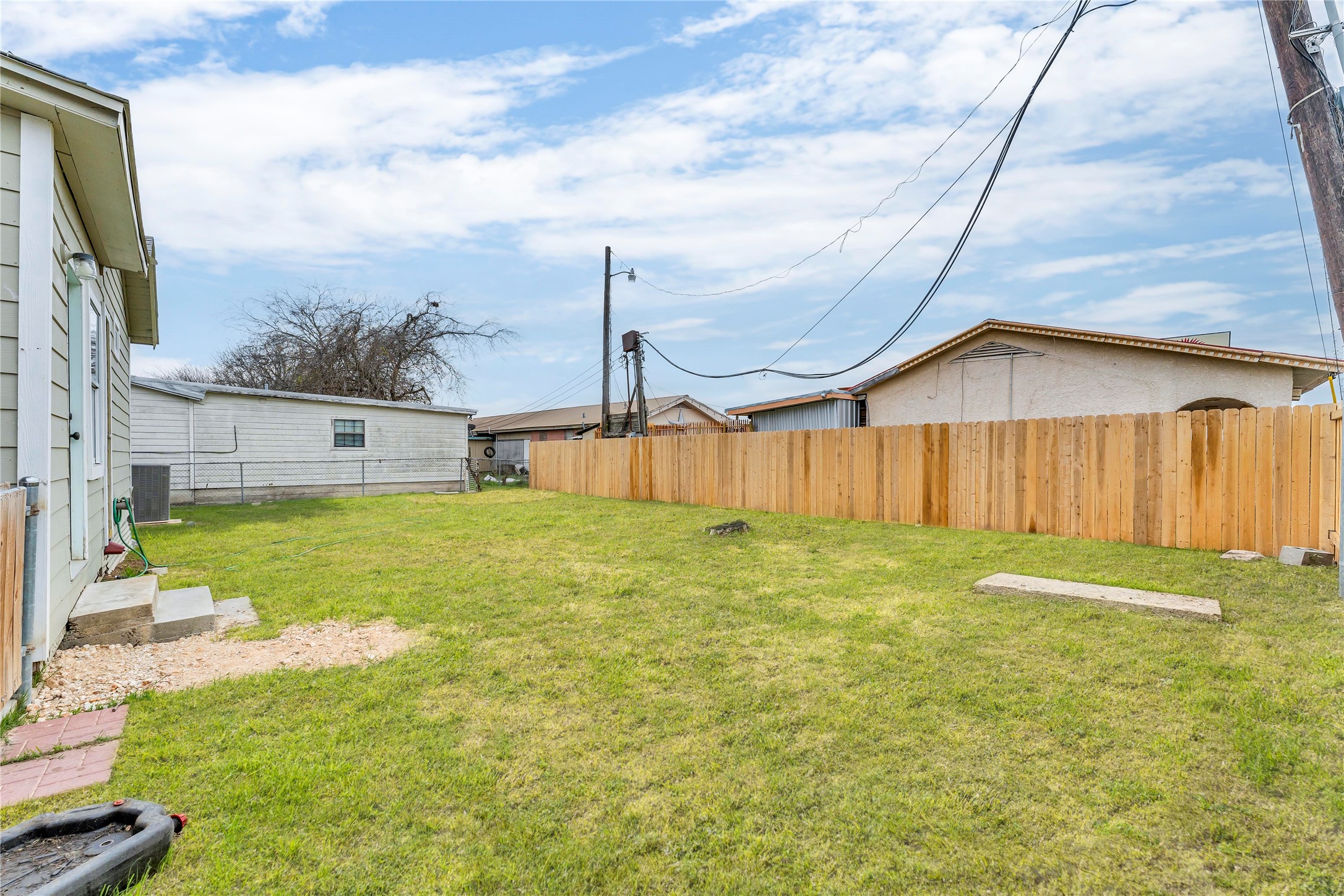 117 Travis Street Taylor, TX 76574 - Photo 19 of 23 a view of a backyard with swimming pool