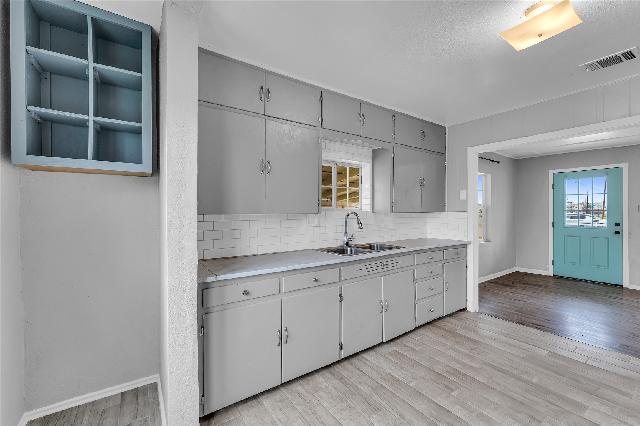 117 Travis Street Taylor, TX 76574 - Photo 6 of 23 a spacious bathroom with a double vanity sink and a mirror