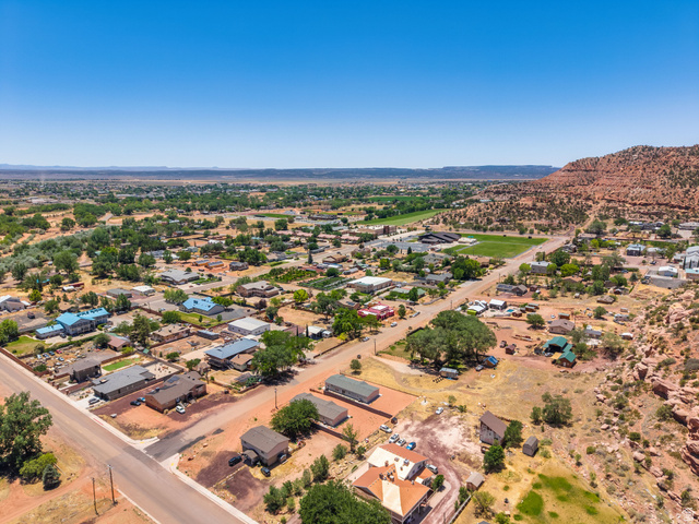 464 Jessop Avenue Hildale, UT 84784 - Photo 69 of 73 Expansive aerial perspective showcasing a residential community with abundant mature trees and natural desert landscaping