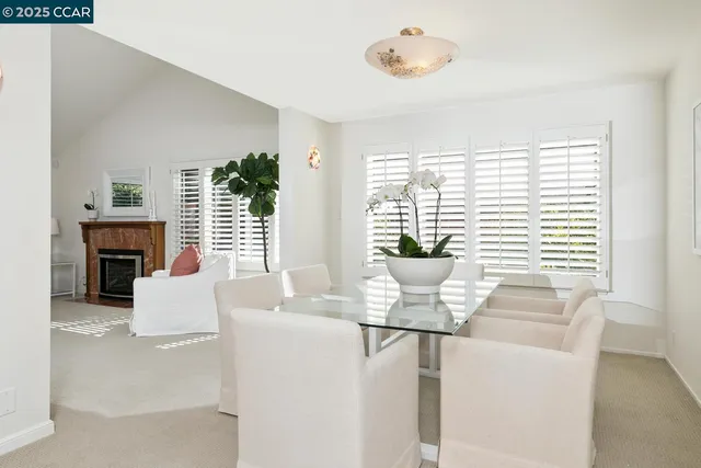 a dining room with furniture and window