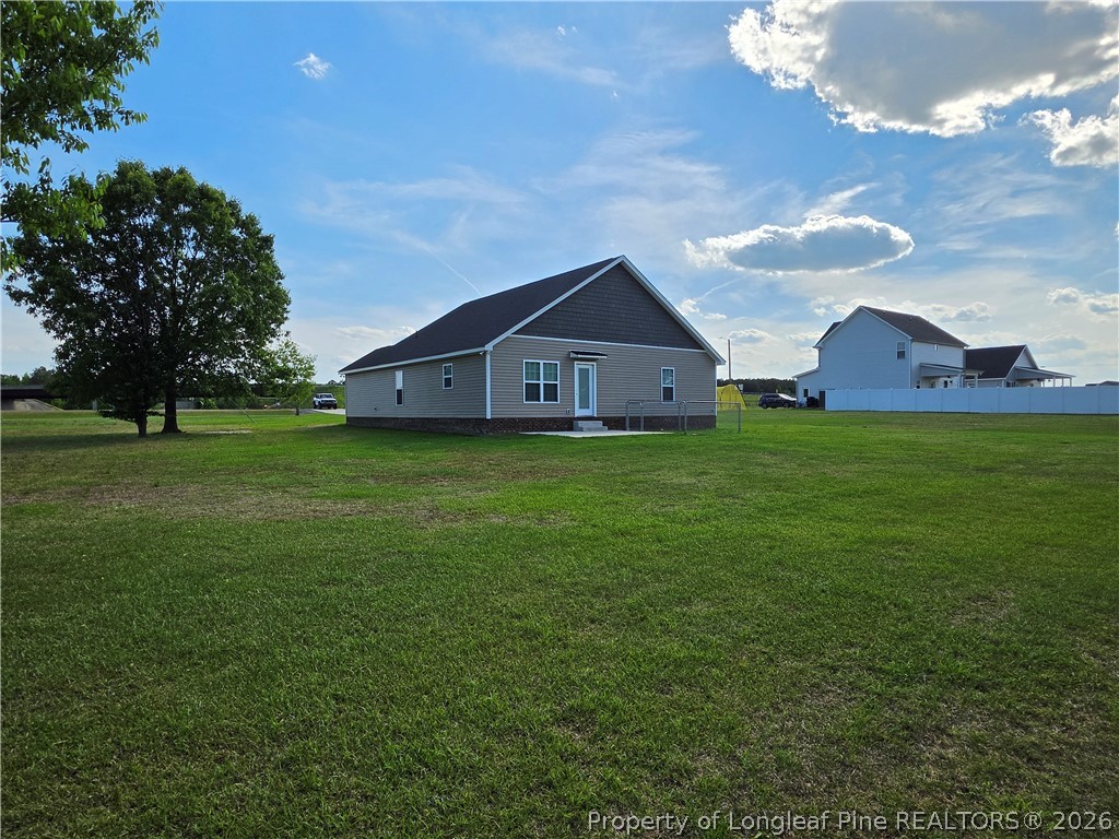 422 Mitchell Farm Road Goldsboro, NC 27530 - Photo 7 of 28 a view of a house with a big yard