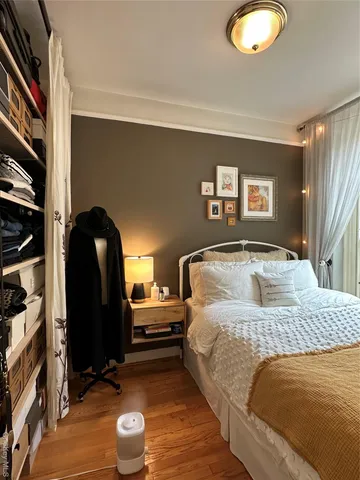 a bedroom with a bed and a closet