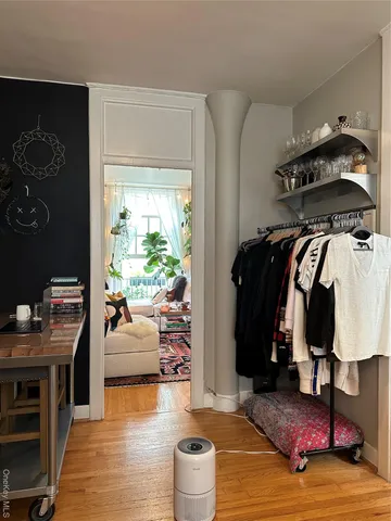 a bedroom with furniture and a closet