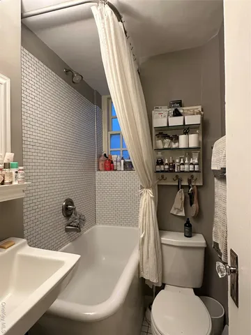 a bathroom with a sink and toilet