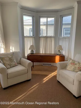 a living room with furniture and window