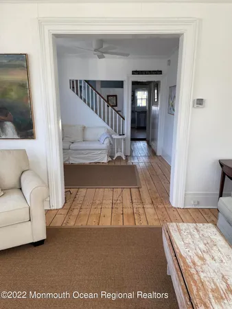 a view of bedroom with furniture and staircase