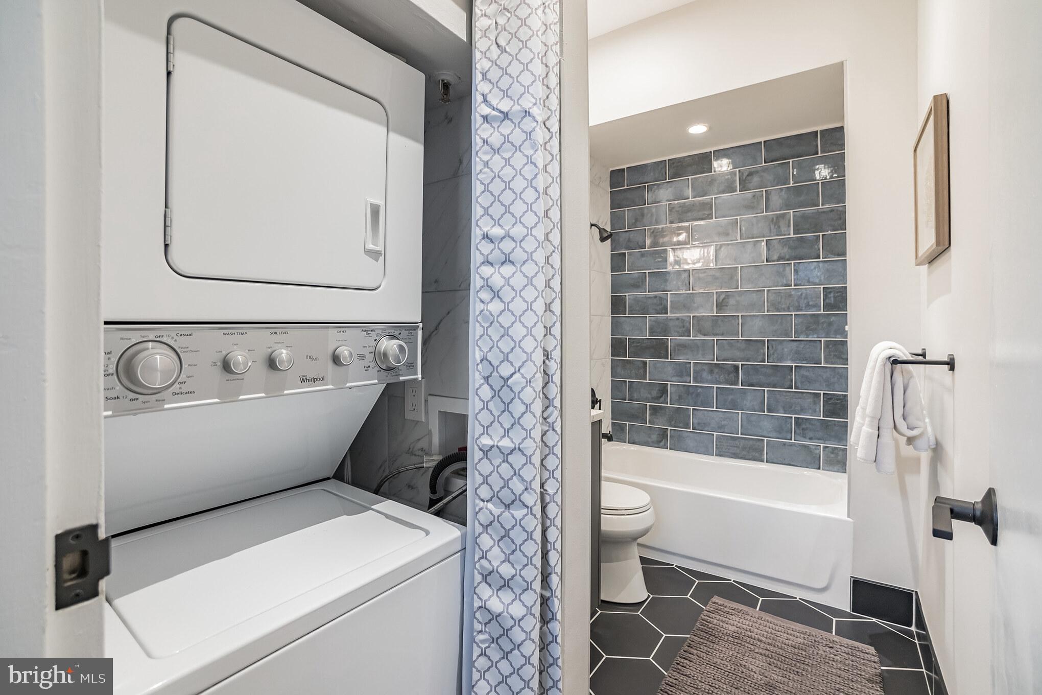 1238 Callowhill Street, Unit 101 Philadelphia, PA 19123 - Photo 12 of 17 a bathroom with a toilet and a bathtub
