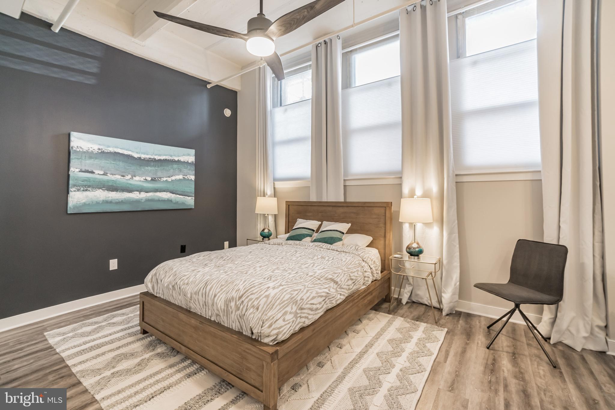 1238 Callowhill Street, Unit 101 Philadelphia, PA 19123 - Photo 8 of 17 a bedroom with a bed and a window