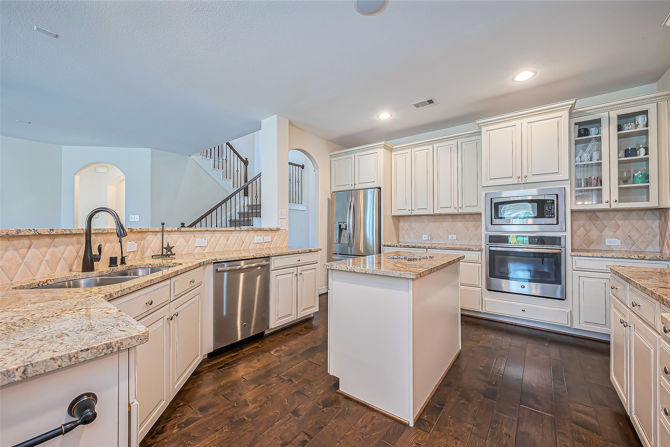 10018 Durango Path Lane Cypress, TX 77433 - Photo 2 of 50 Elegant and expansive kitchen with modern appliances and ample storage.