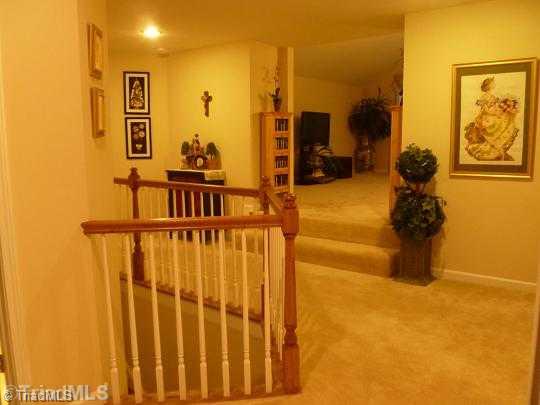 3073 Sycamore Point Trail High Point, NC 27265 - Photo 5 of 10 Other. Upper level hallway showing a 2-step elevated entrance to the 17 10" x 16 5" playroom