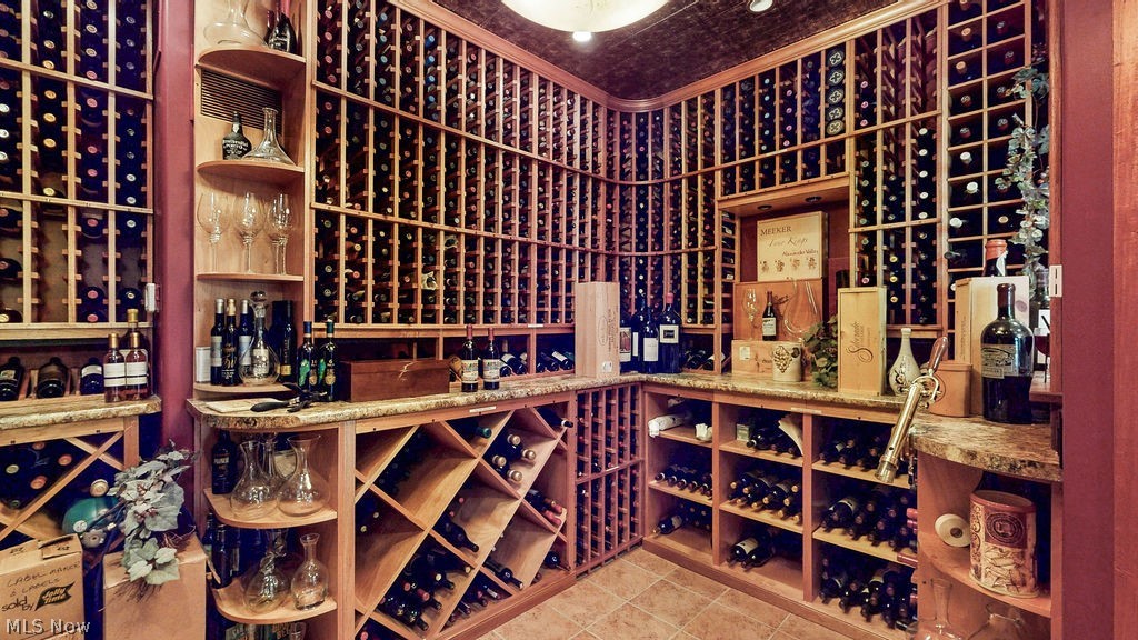 1431 Cedar Point Road Sandusky, OH 44870 - Photo 11 of 50 Wine room featuring ornamental molding