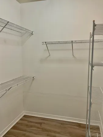 a view of a room with racks on the wall