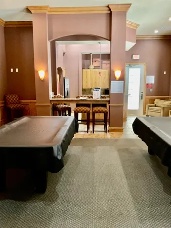 a lobby with furniture and a large window